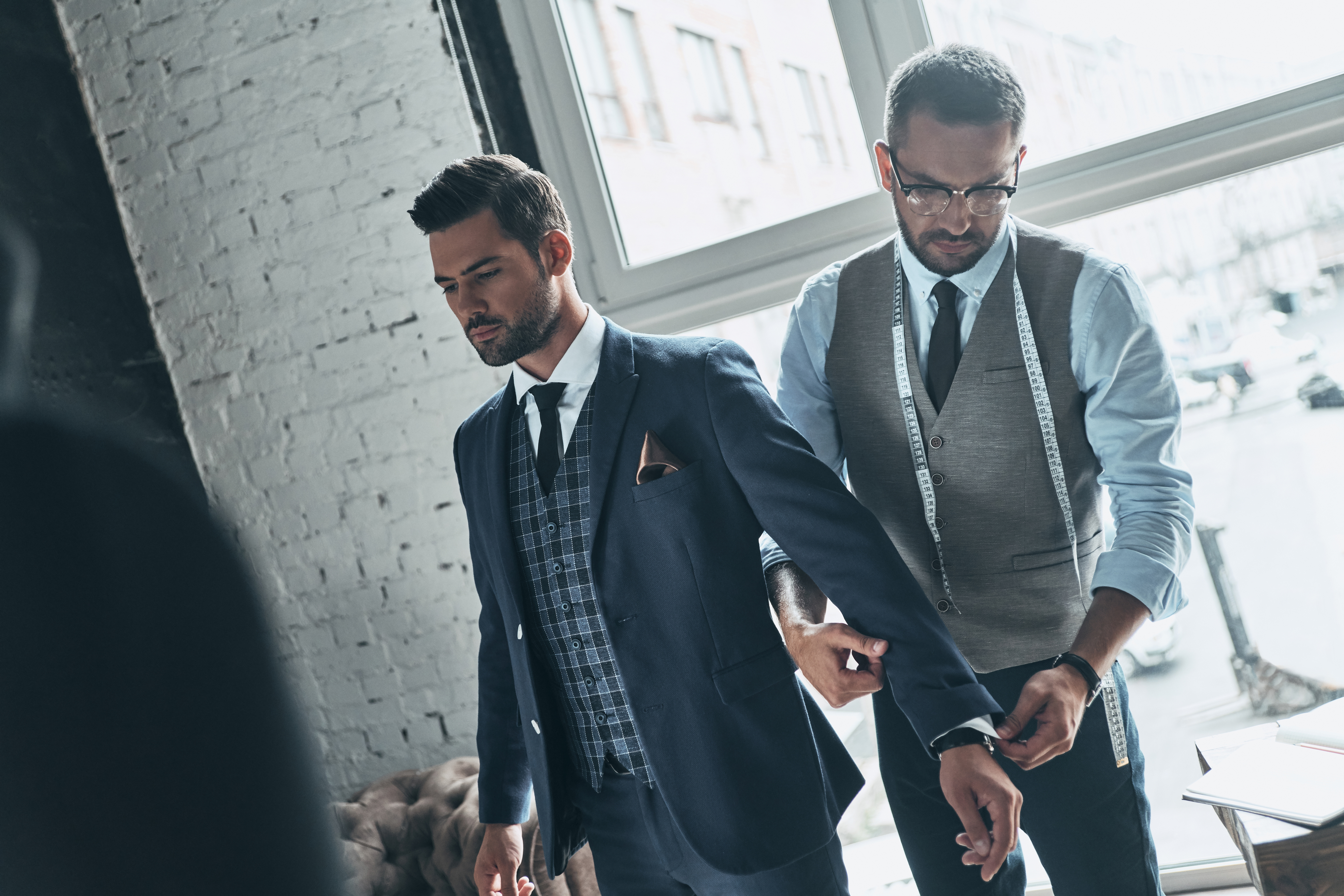 Tailor fitting a bespoke suit — Jonathan P Farley, London