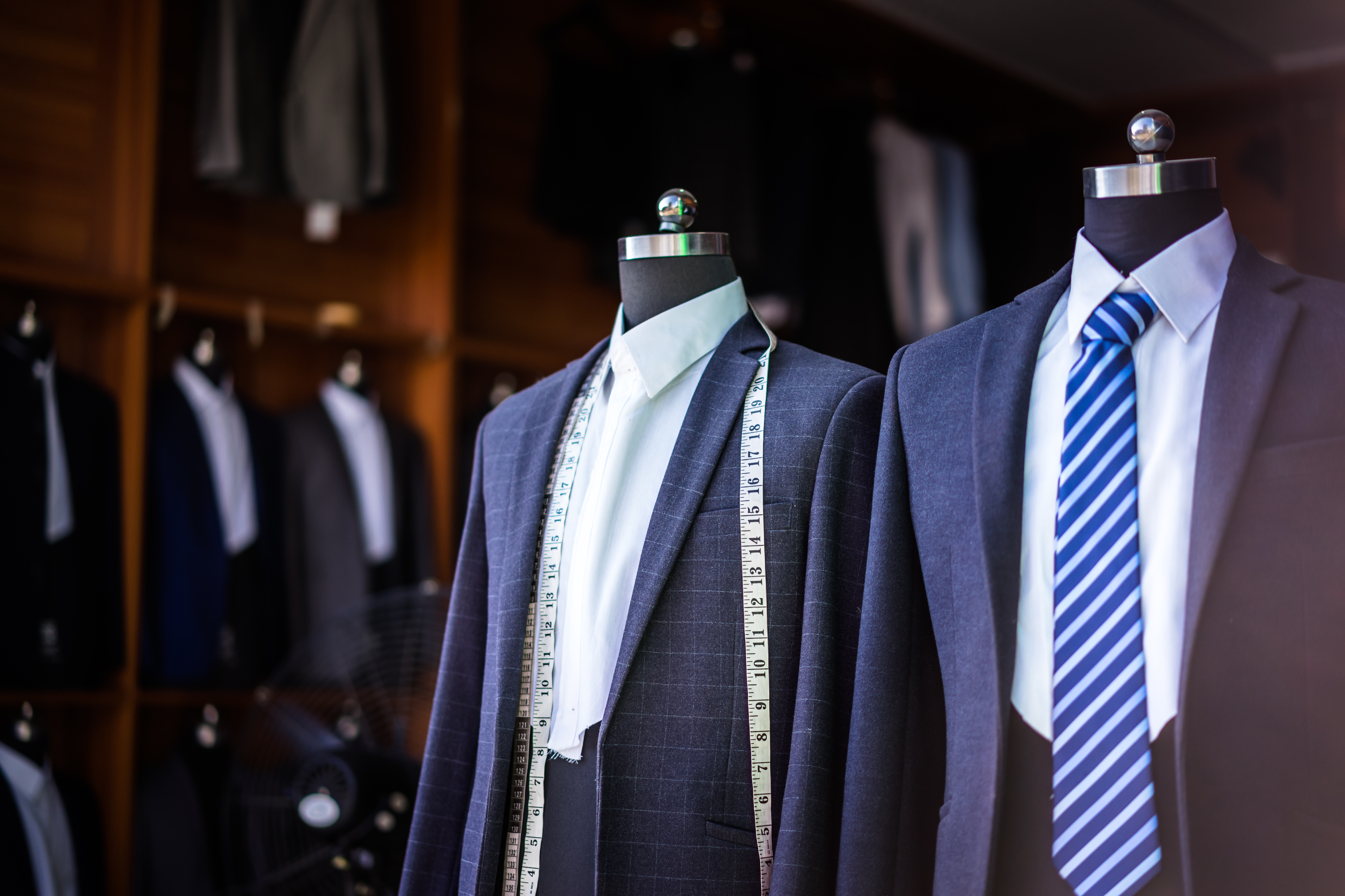 Tailored suits on mannequins in the studio