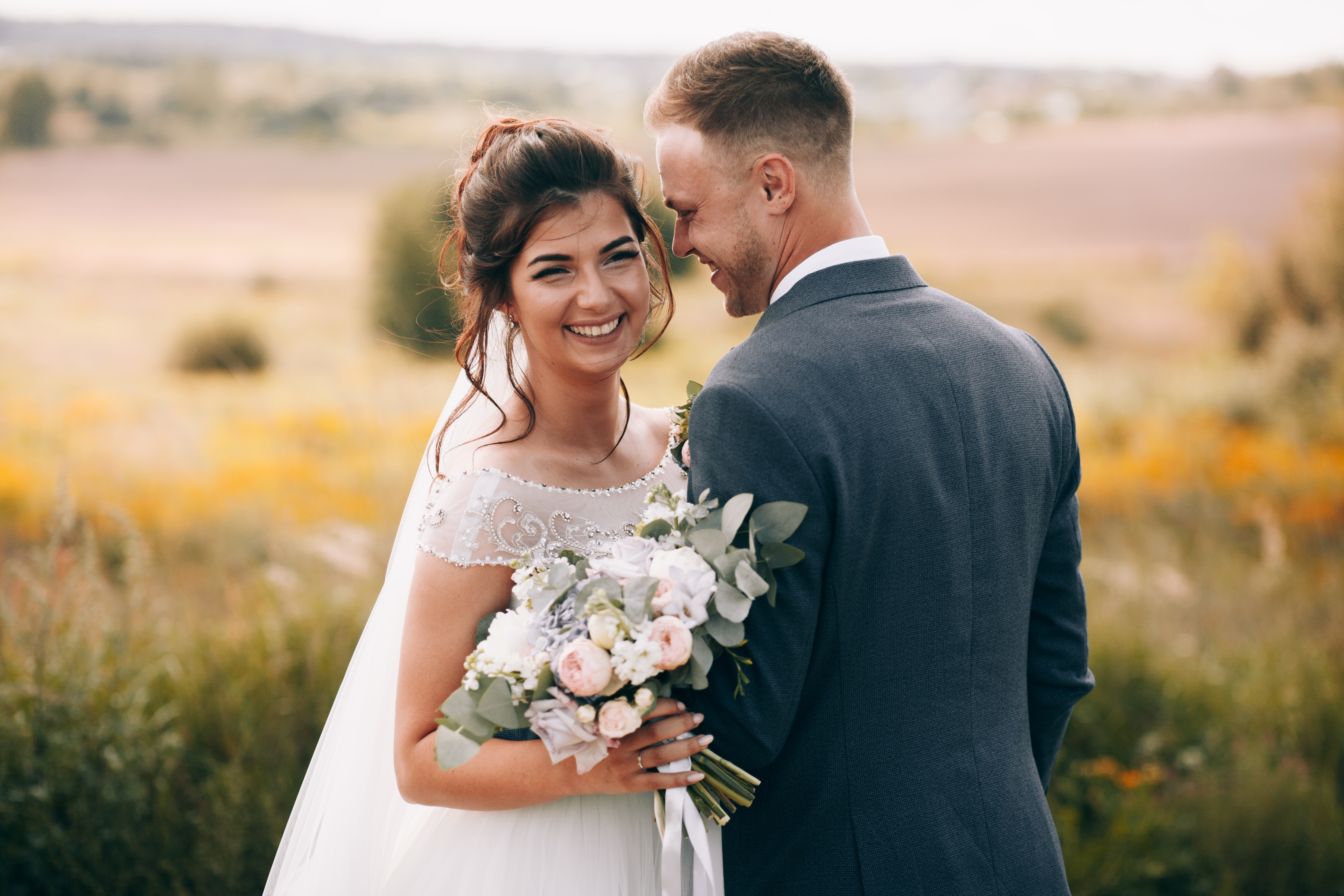 Groom in tailored grey suit